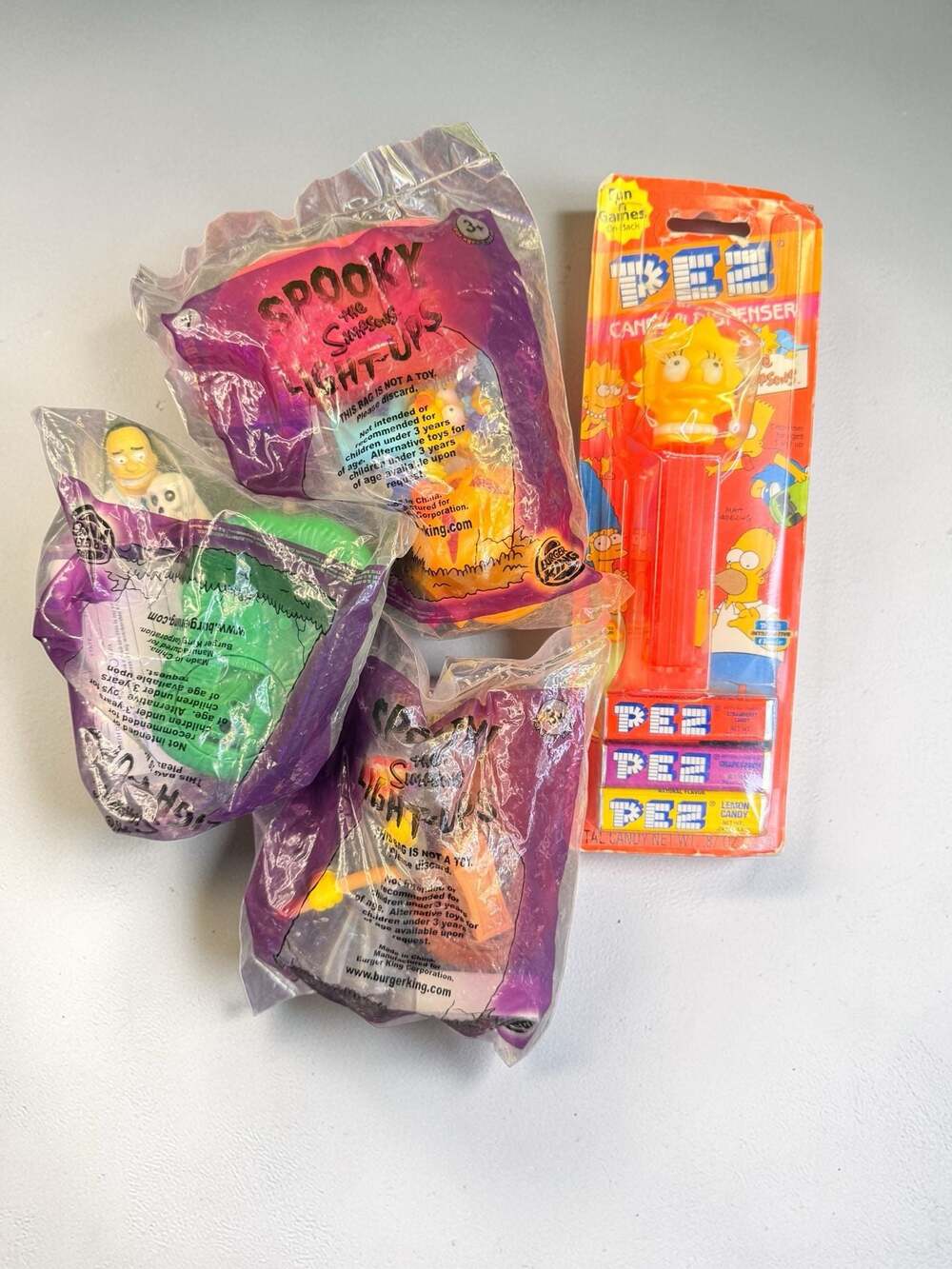 Vintage Simpsons Collectible Lot: Spooky Burger King Toys and Lisa PEZ Dispenser